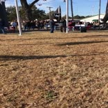 Max Hughes plays Taps while hoisting MIA flag